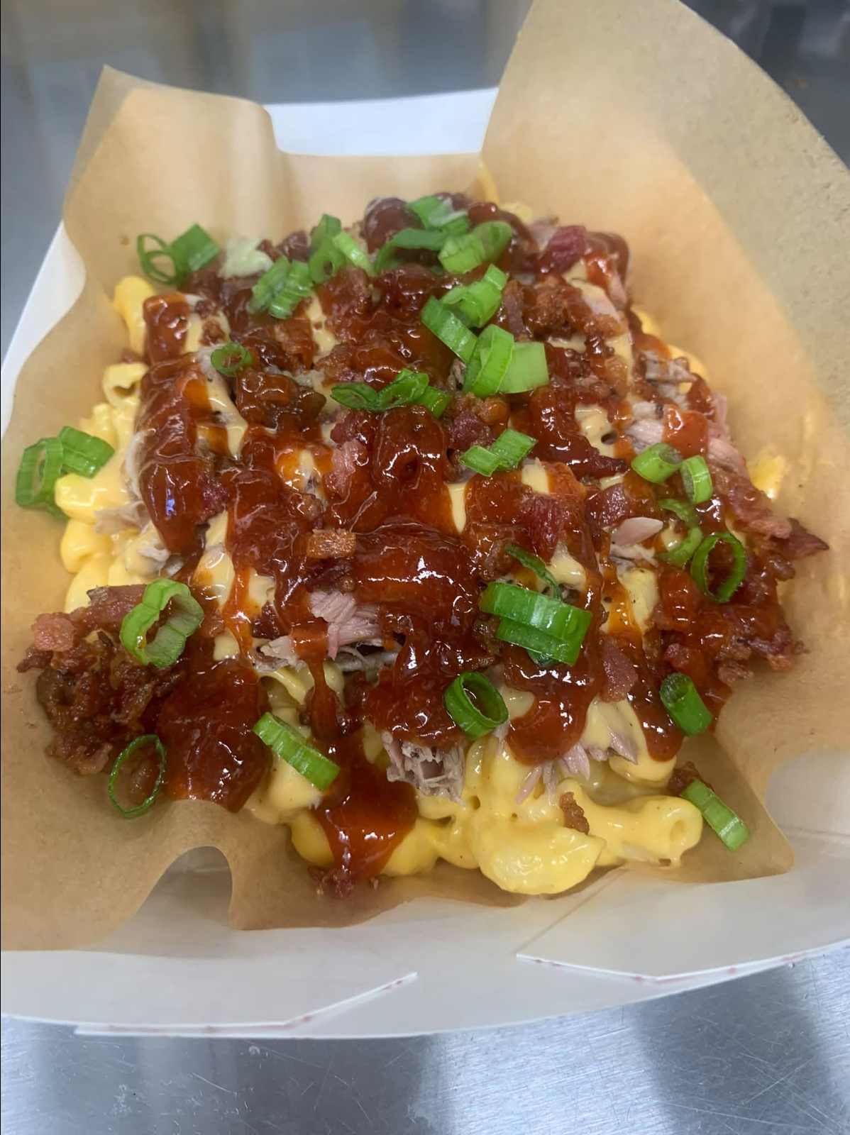 Loaded BBQ mac and cheese with pulled pork, bacon and green onion